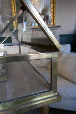 Fabulous quality french brass display cabinet with lift up top and securing side bars circa 1900.