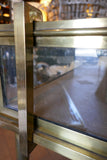 Fabulous quality french brass display cabinet with lift up top and securing side bars circa 1900.