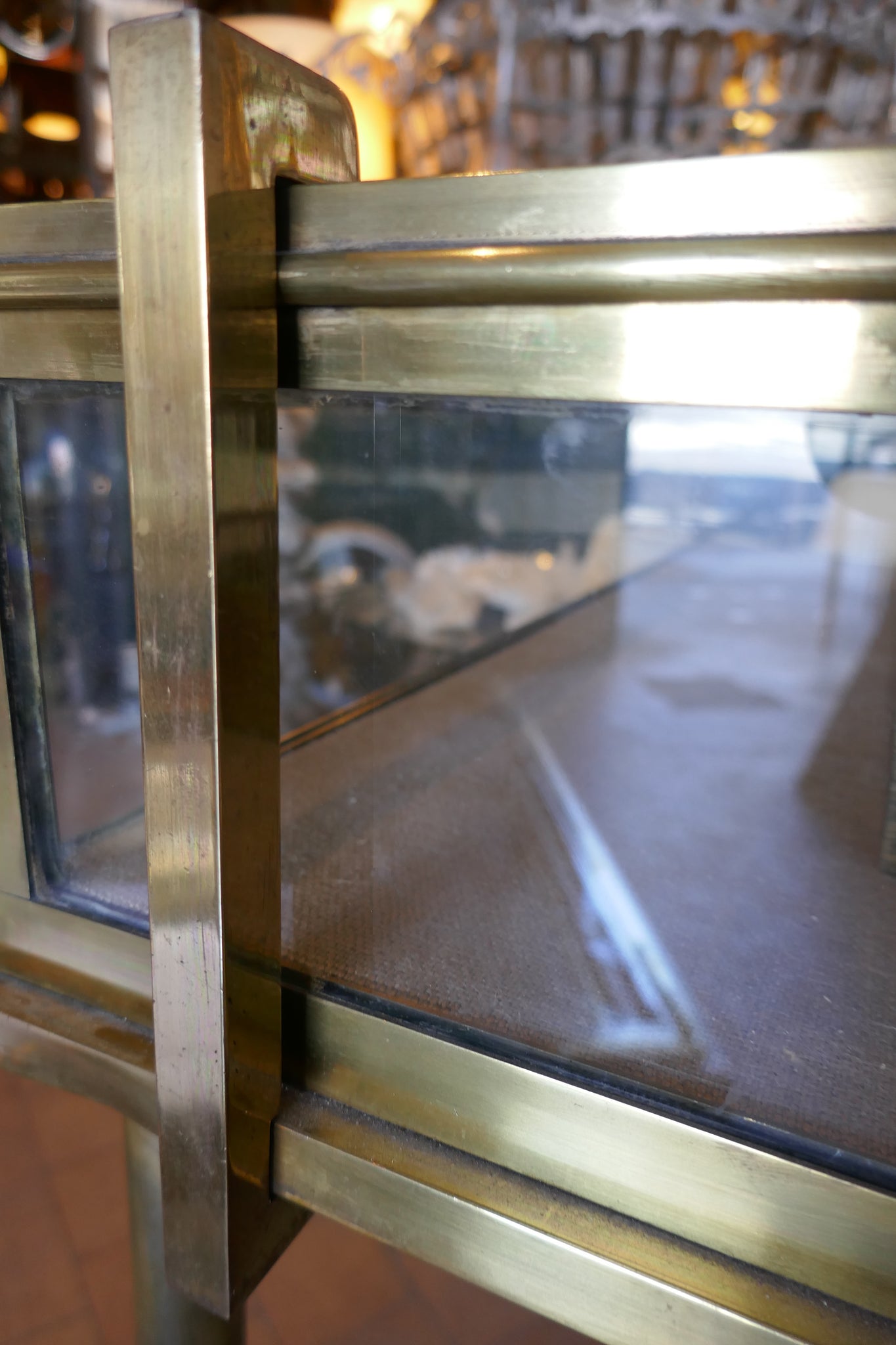 Fabulous quality french brass display cabinet with lift up top and securing side bars circa 1900.