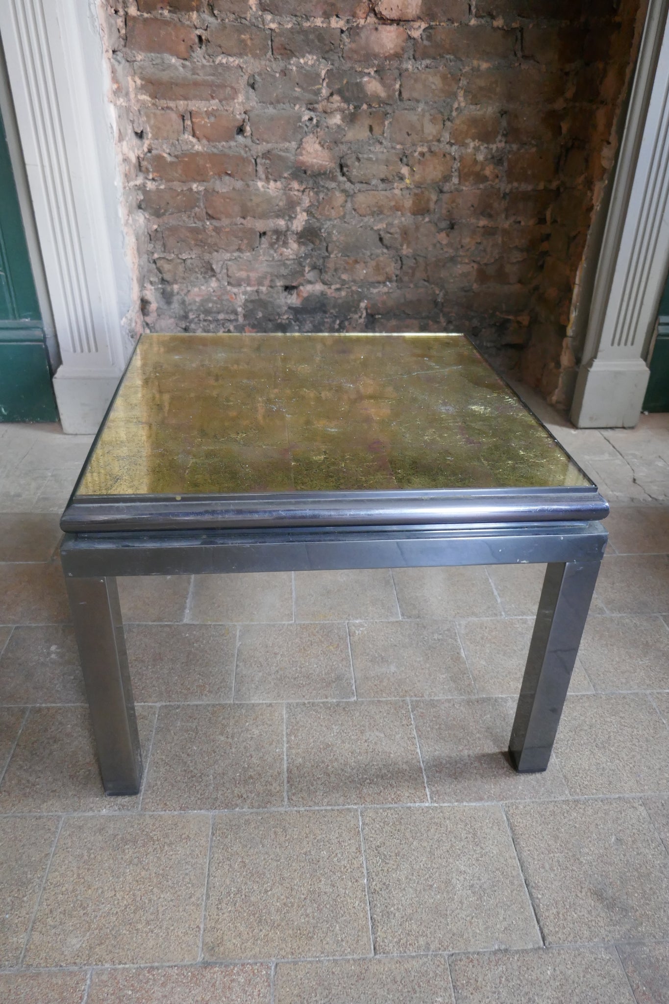 Pair of 1970's steel side tables with gold Verre Eglomise  tops .