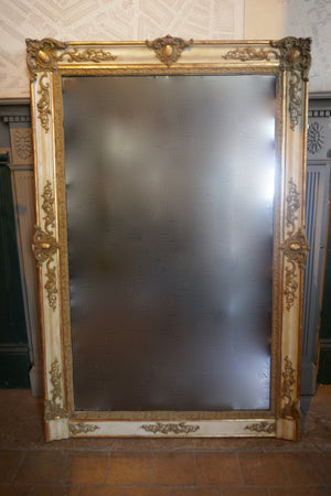 Highly decorative french mirror with original parcel gilt finish and original glass.