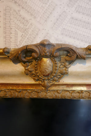 Highly decorative french mirror with original parcel gilt finish and original glass.