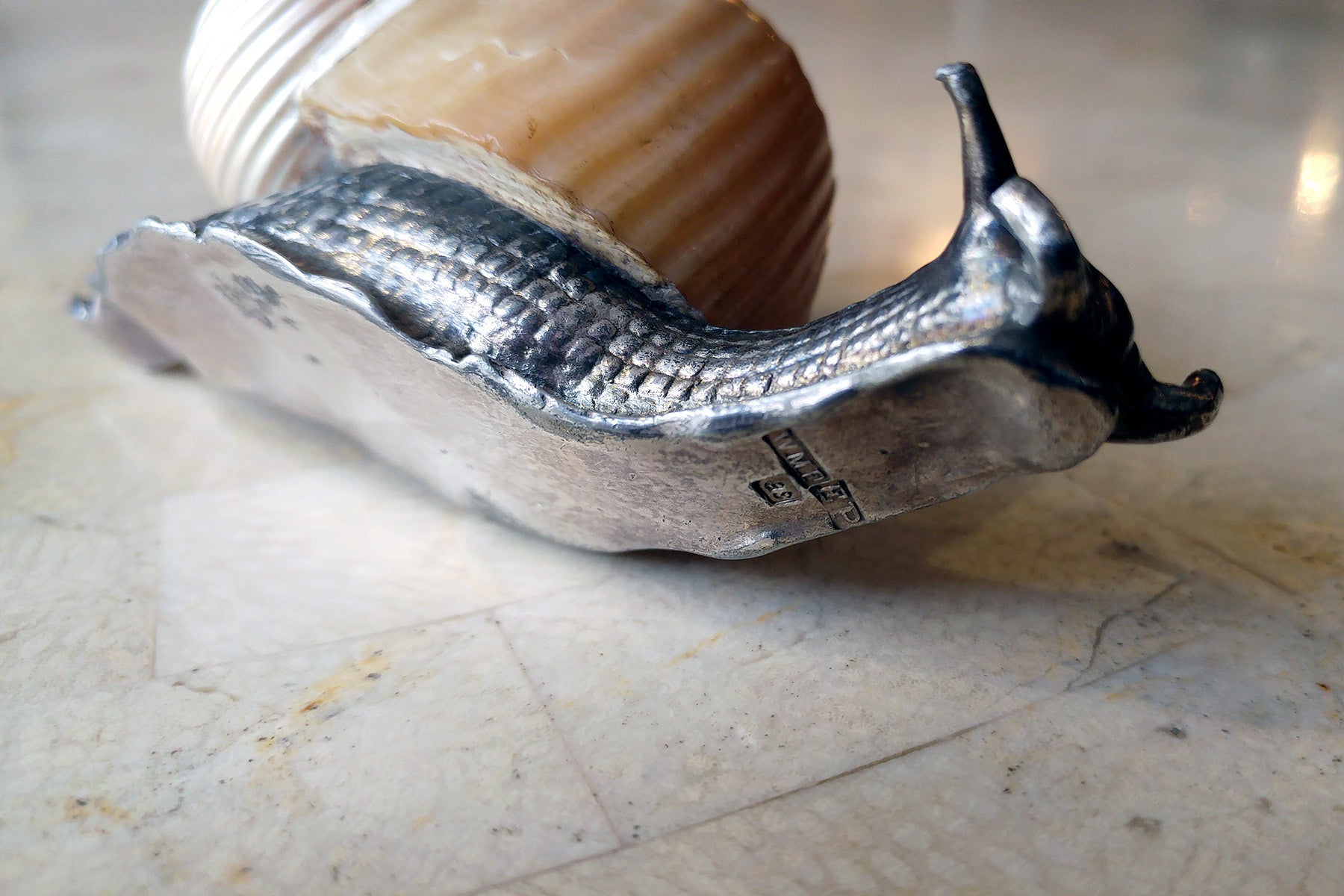 WMF (signed) silver plated snail with polished shell table ornaments.
