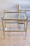 Fine quality pair of brass side  tables with mirror banded glass shelves.
