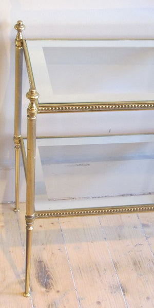 Fine quality pair of brass side  tables with mirror banded glass shelves.