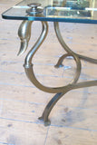 Forged bronze and glass side table with swan neck detail circa 1970.