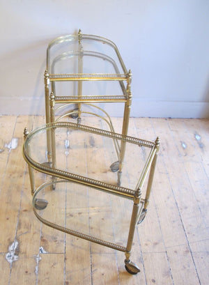 X Decorative three tier brass nest of tables.