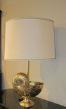 A large french brass lamp in the form of a Nautilus shell circa 1970.