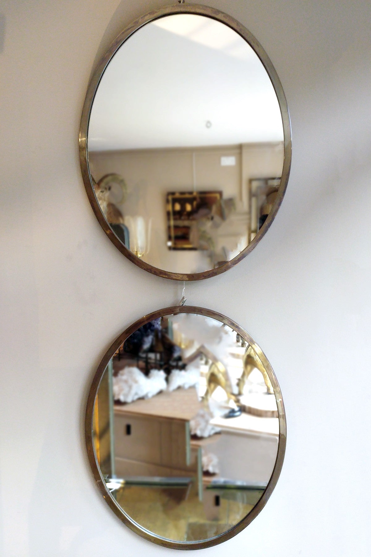 X Pair of Italian solid brass oval  mirrors circa 1960 .