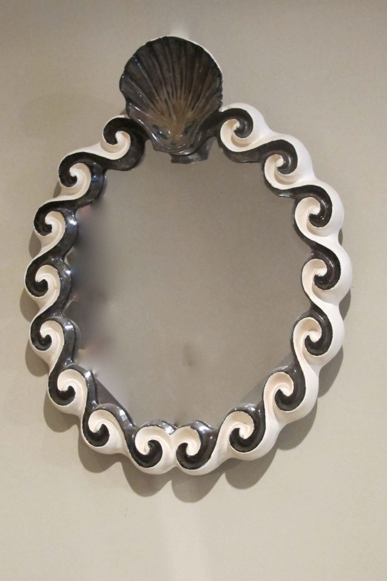 X Ceramic mirror with shell crest by G.Dooley.