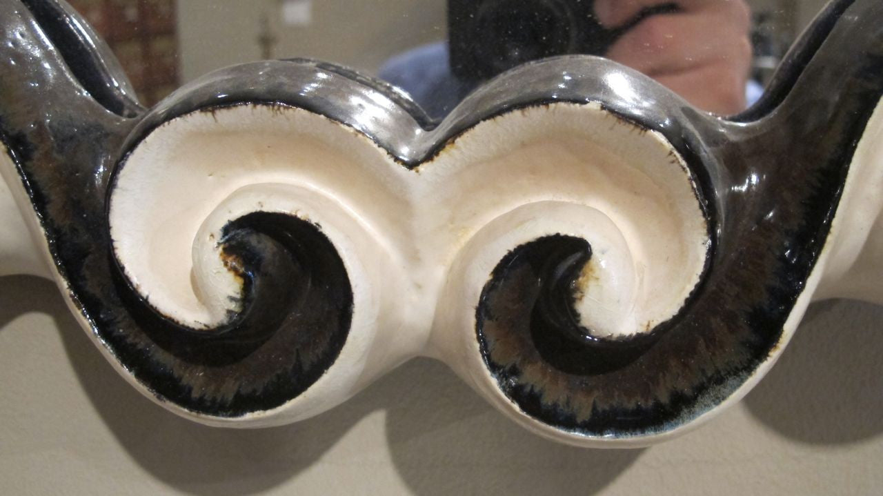 X Ceramic mirror with shell crest by G.Dooley.