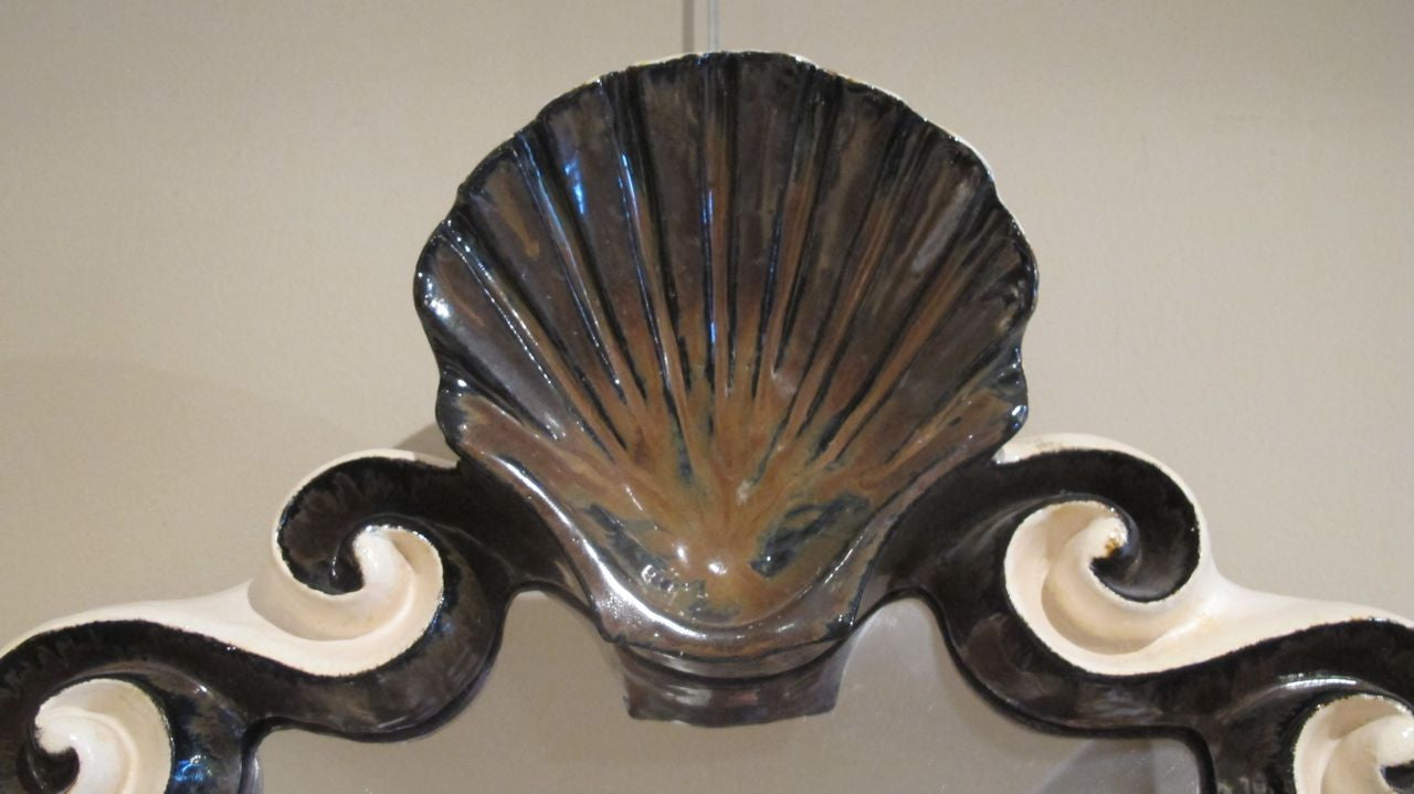 X Ceramic mirror with shell crest by G.Dooley.