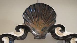 X Ceramic mirror with shell crest by G.Dooley.